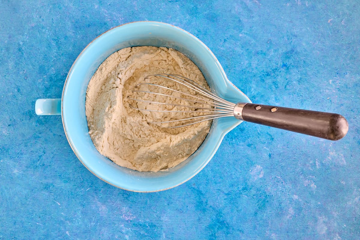 dry ingredients that have been mixed together in a bowl with a whisk