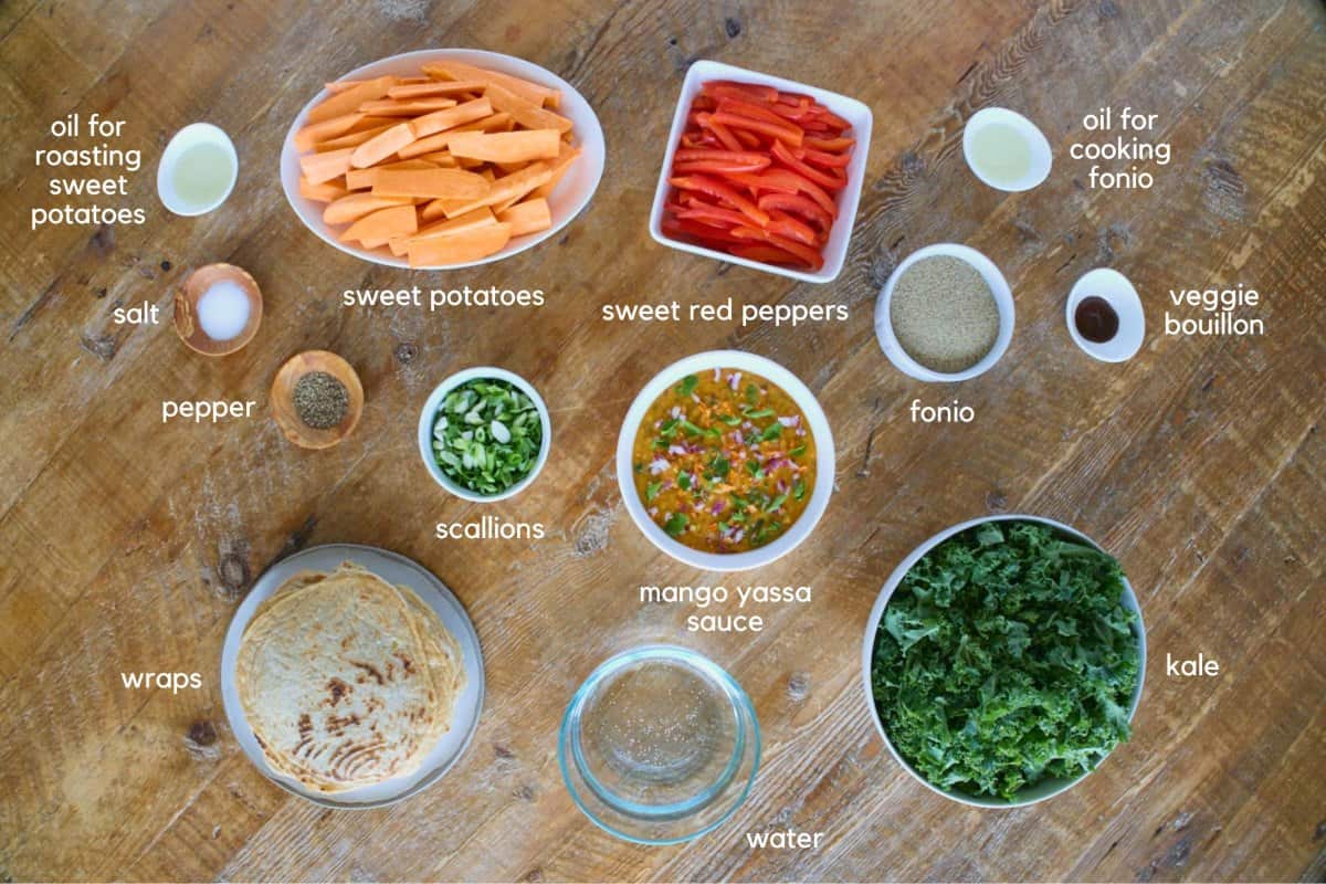 labeled wrap ingredients in bowls and a plate on a table