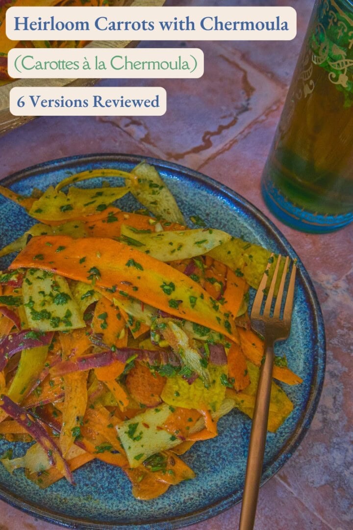 carrot ribbons in chermoula sauce on a plate with a fork, a large wooden bowl of carrots, a napkin, and a glass of mint tea
