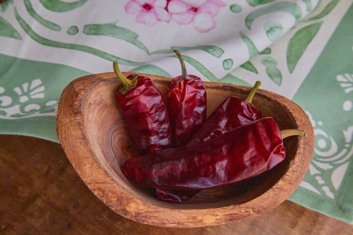 dried piment de bresse peppers atop a kitchen towel