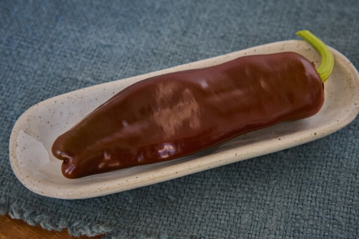a fresh berbere pepper in a bowl atop a napkin