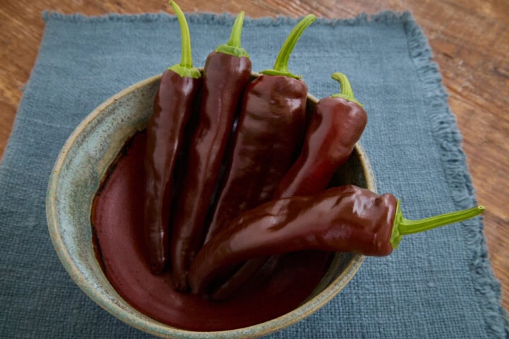 fresh berbere peppers in a bowl atop a napkin