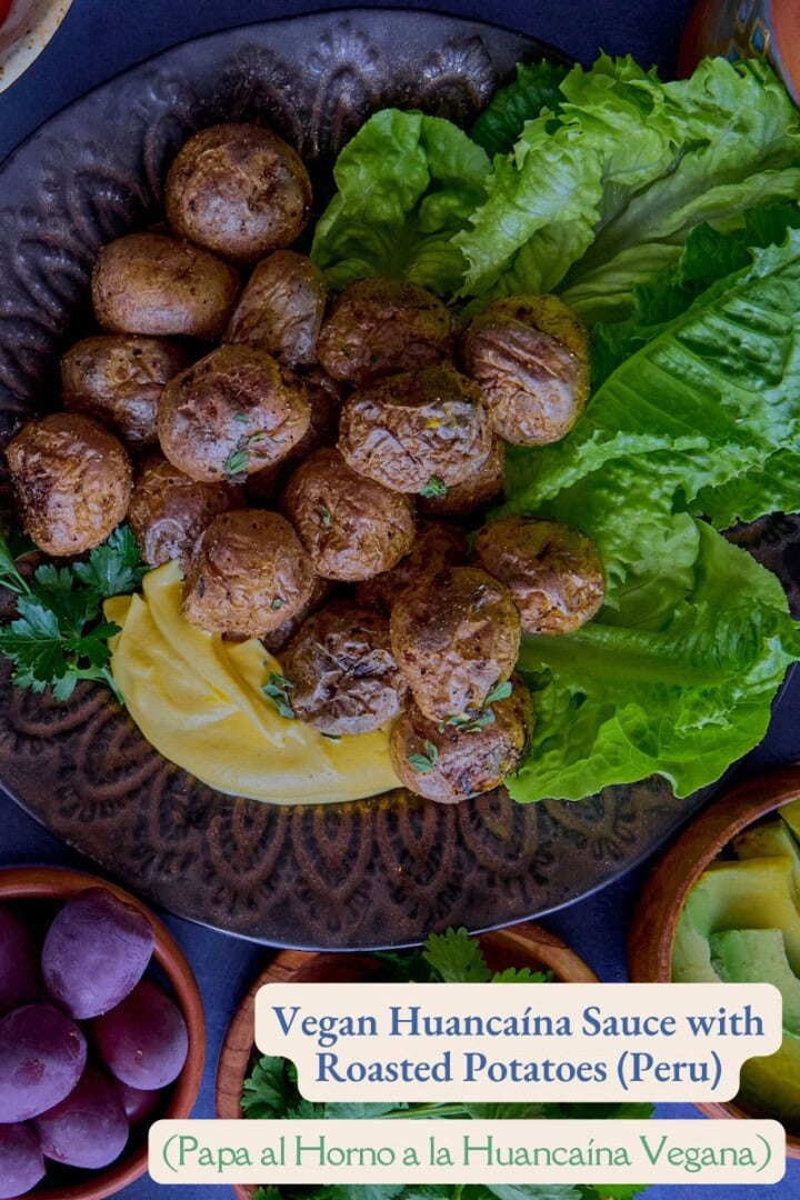 a plate of lettuce and roasted baby potatoes with huancaína sauce, olives, avocado slices, olives, chirulín cocktail, and cilantro