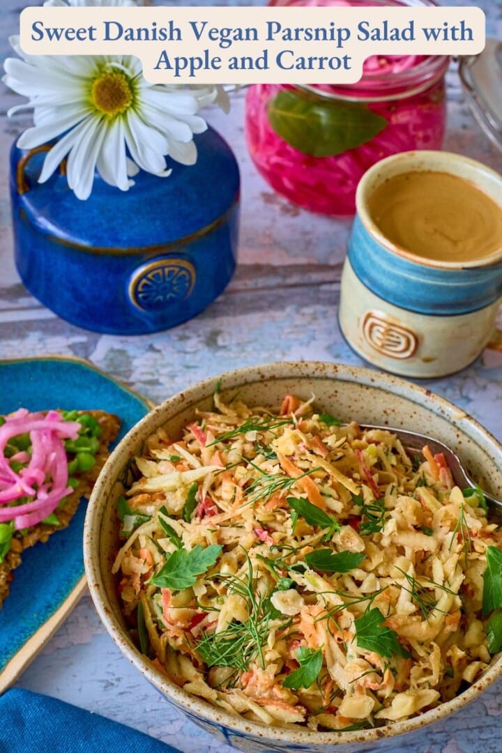 a labeled photo with a bowl of parsnip salad and fork, a crispbread with peas and onions on a plate, napkin, vase of daisies, jar of pickled onions, and cup of coffee