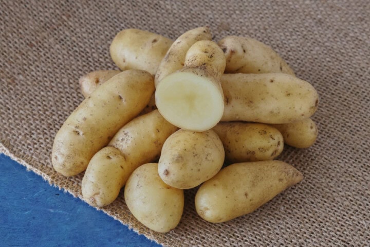 austrian crescent potatoes on burlap over a background